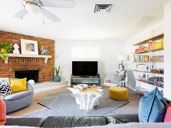 Big open living space with fireplace and enough space for multiple sitting areas