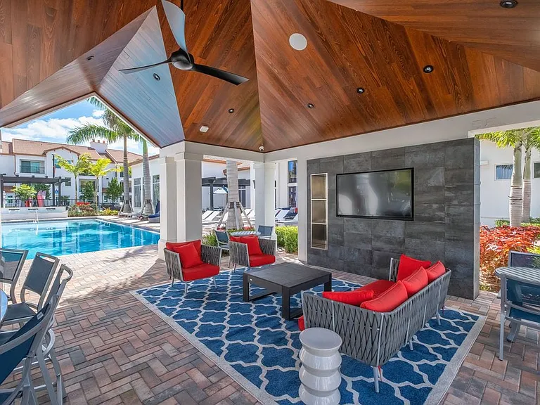 West Phase outdoor lounge with TV and seating areas