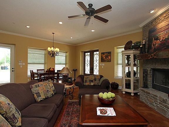 10 foot ceilings throughout with 8 foot doors. Cozy, full stone fireplace with built-in media center add comfort and flair to the living room.