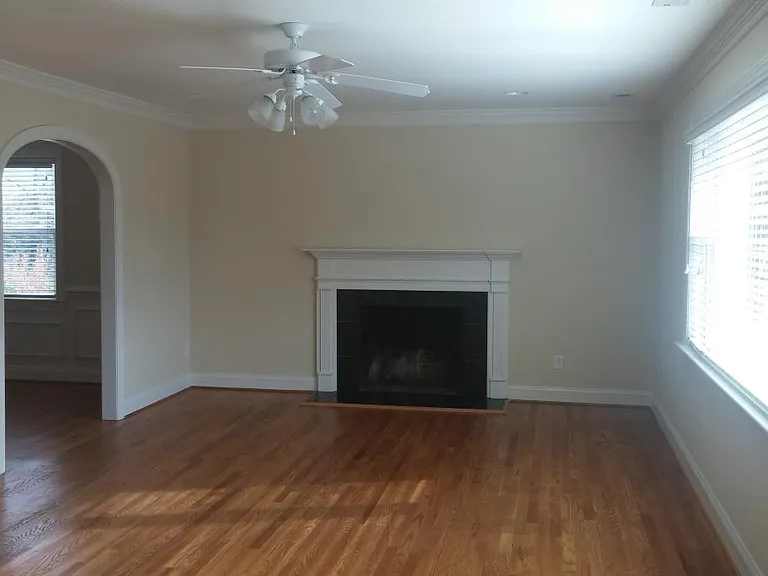 large living room with fireplace, sunny view of Monument Ave