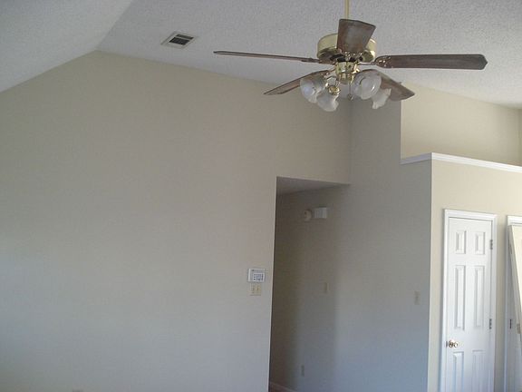 Plant shelf above pantry & broom closet in eat in kitchen