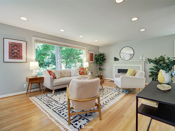 Light filled living room with hardwood floor.