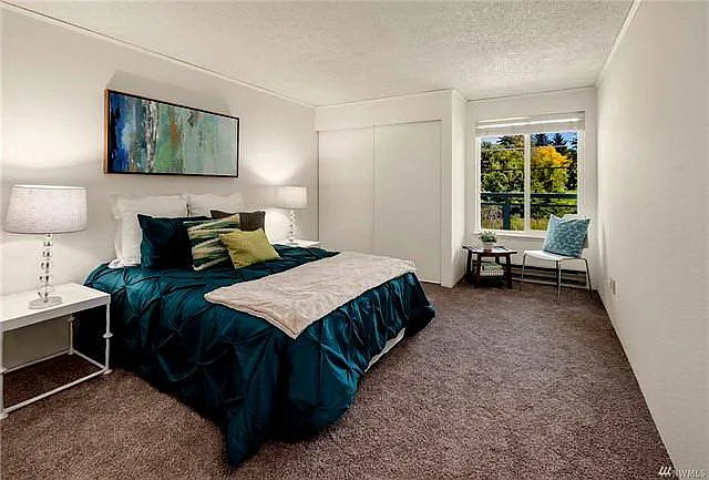 Large Bedroom With Two Walls of Closets