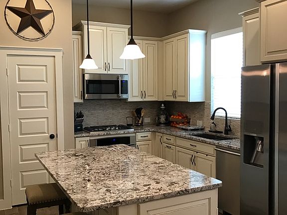 Upgraded cabinets & granite