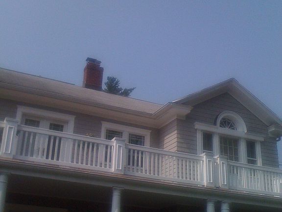 New Cedar Railings Applied and decking on upper balcony.