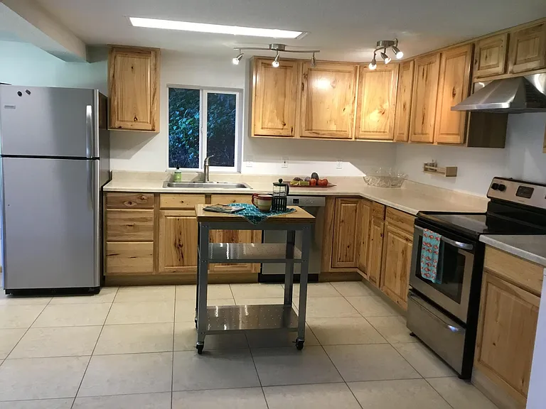 Delux Open hickory cabinet kitchen. Ice maker too.
