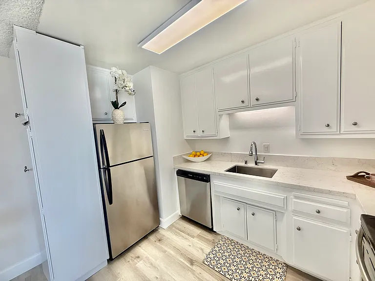 New quartz countertops! All stainless steel appliciances. Stove, fridge, dishwasher and microwave included