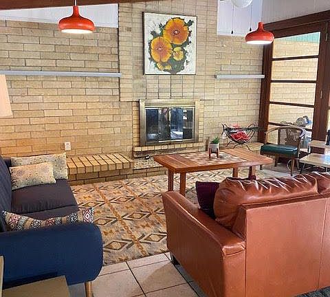 Living room with Ocala block walls, vaulted wood ceilings