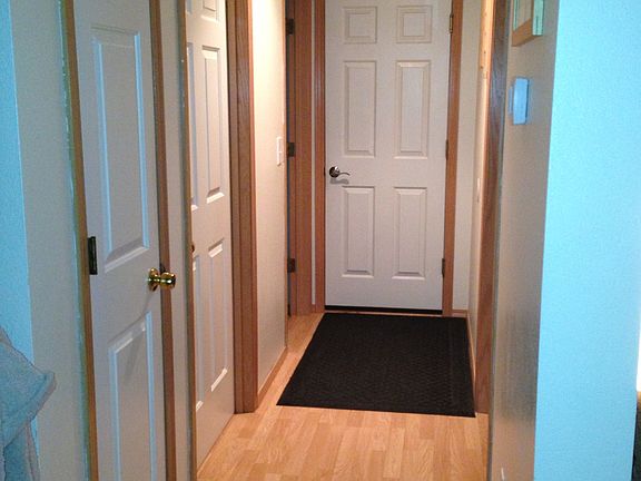 Downstairs hallway to garage, laundry room and bathroom