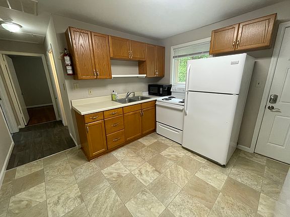 Another view of the kitchen. There is a backdoor to rear stoop and yard
