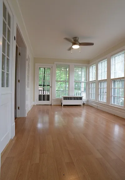 Sunroom. Sometimes used as 3rd bedroom. It has it's own small deck. Newly painted.