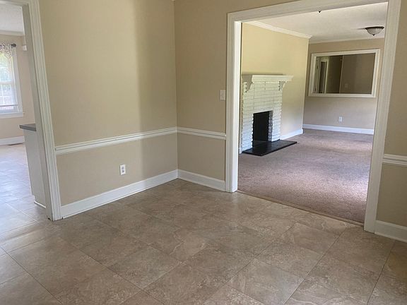 Dining room looking toward the entry way and front room for many possible uses.