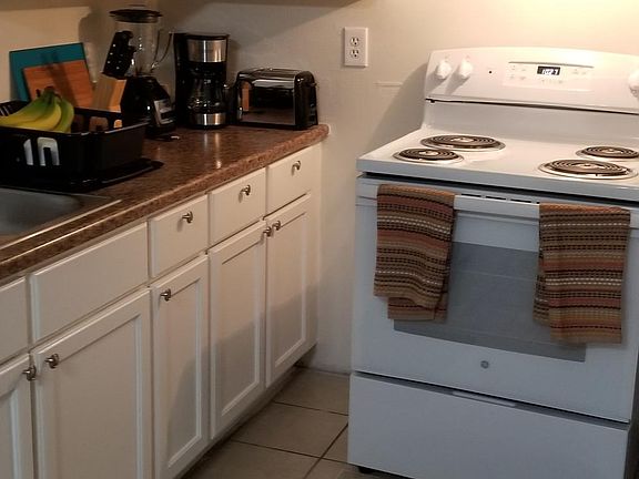 Kitchen counter, cabinets and Stove/Oven (included in unit)