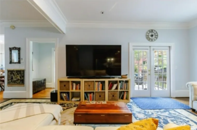 View from kitchen into living room - french doors open into front porch