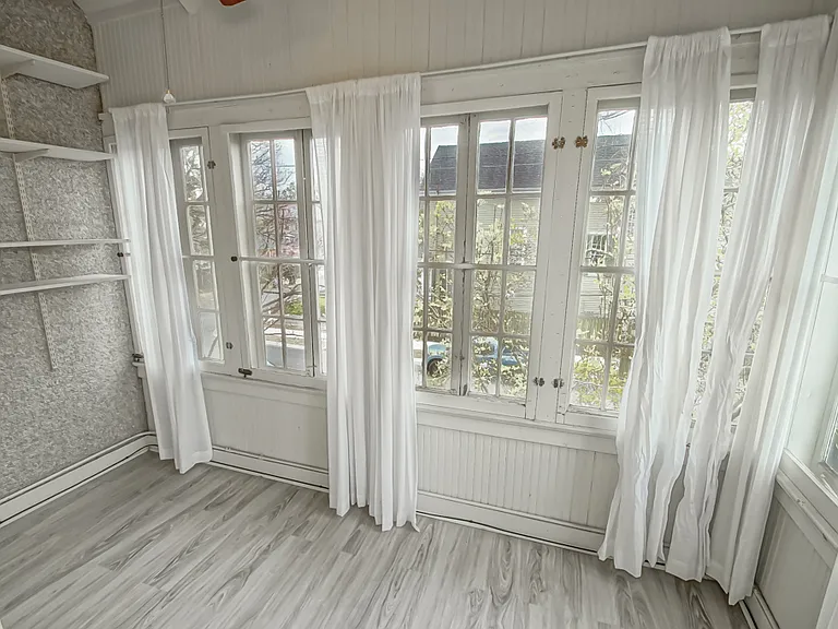 Solarium off main bedroom upstairs, front of home.