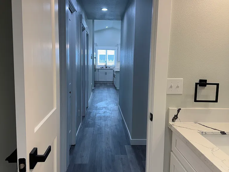Hallway from bathroom to living room/kitchen
