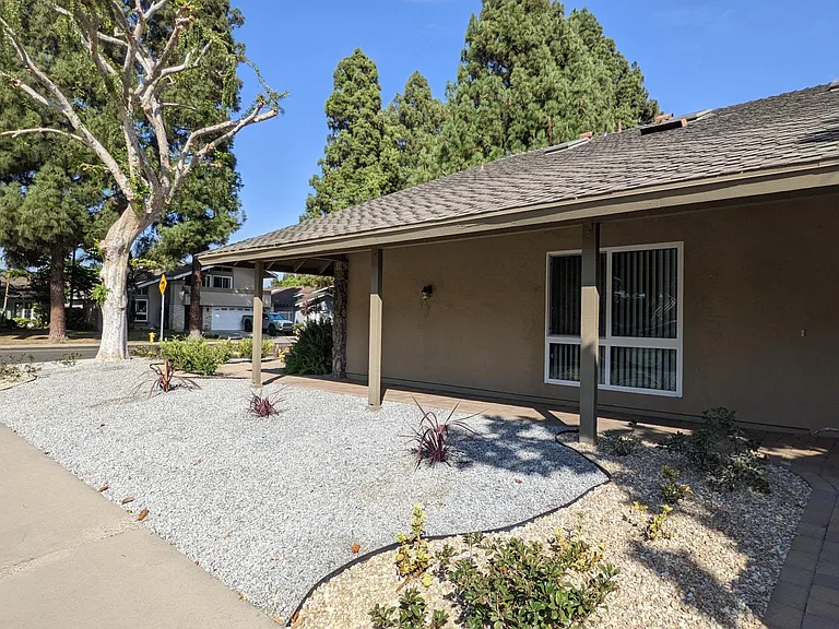 The house in located on a corner lot. The front was recently relandscaped to with drought tolerant place and drop irrigation to save on water