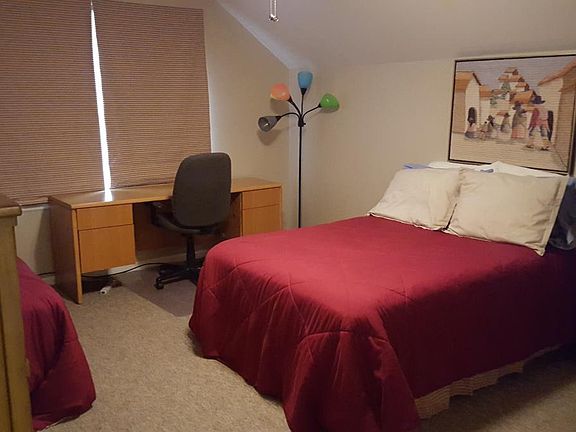 Bedroom with view of desk
