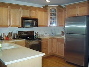 kitchen with stainless steel appl & corian counters