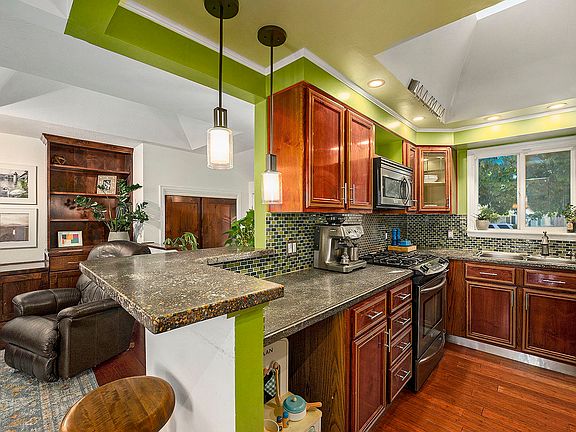 Beautiful kitchen with built-in cabinetry and storage and lighting galore!