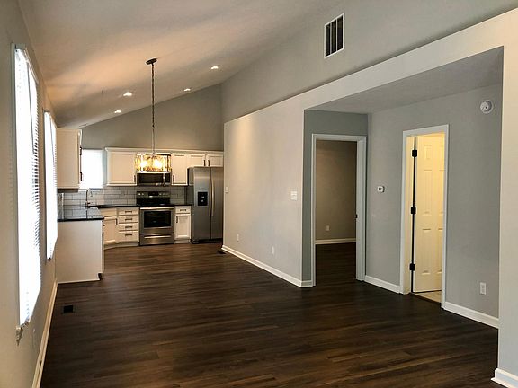 View from entrance. Open floor plan. Hardwood floors.