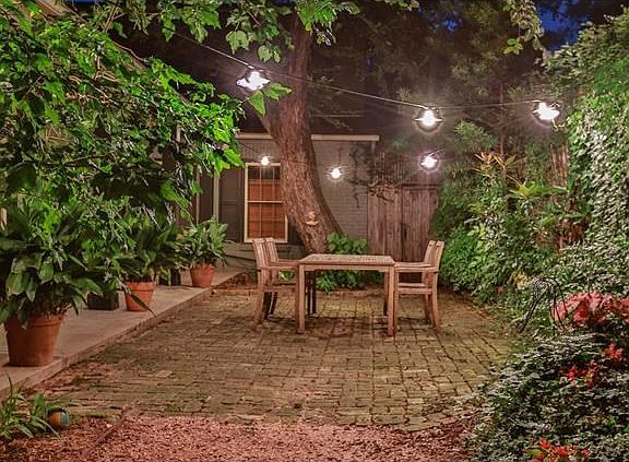 Another view of this magnificent yard at night.  Back gate leads to a huge storage room.
