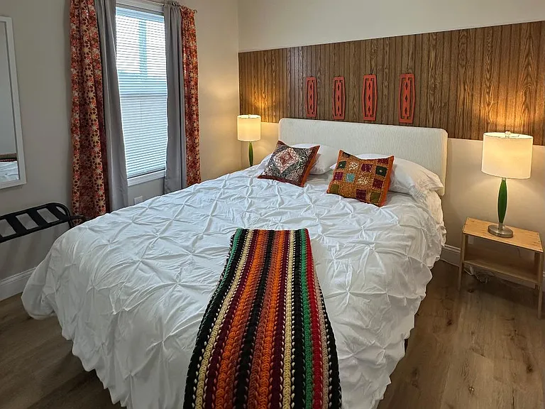 Queen bed in guest bedroom