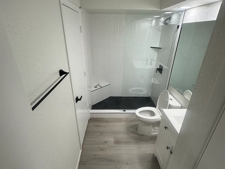 Downstairs bathroom with new walk in shower and vanity