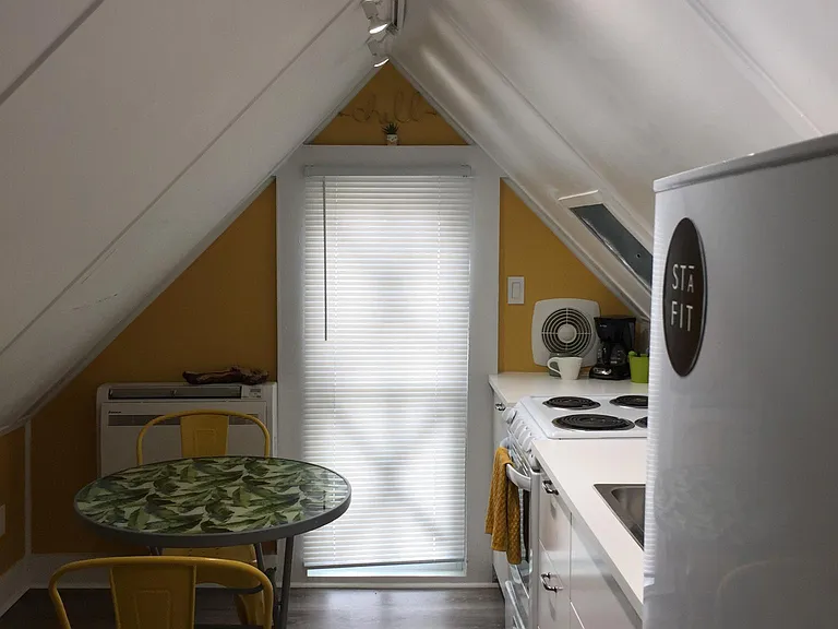 Galley kitchen with skylight and room for small table and chairs