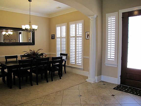 8 foot wrought iron entry door. Decorative columns and 8"moldings.