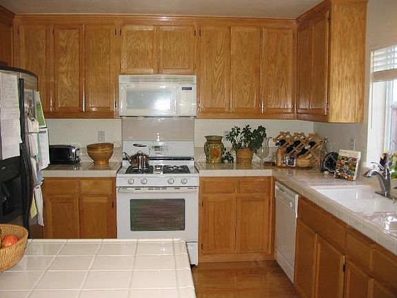 Kitchen with Tile Counters & Hardwood Floor