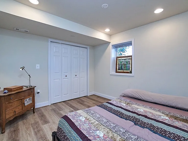 2nd bedroom with closet and two windows. New paint and luxury plank floors.