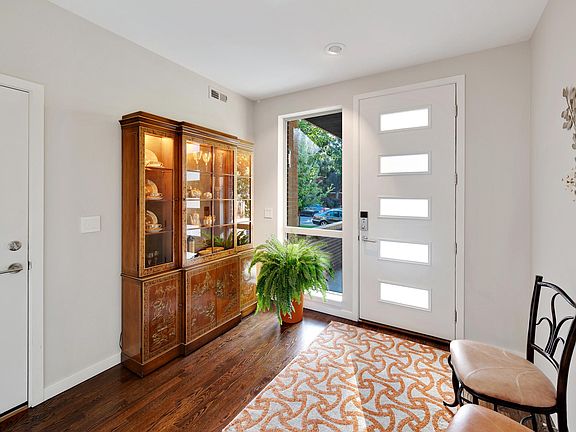 Entryway from street and from garage including display cabinet (ground level)
