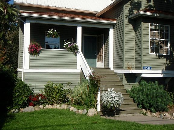 Just the right amount of front yard and covered front porch behind the picket fence.