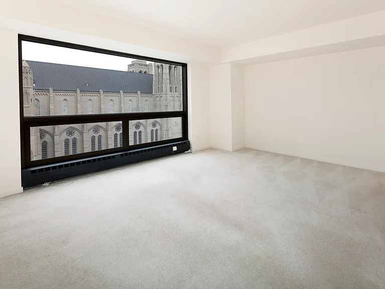 A very spacious loft bedroom. Fully carpeted floors with a mirror-covered sliding closet, and own toilet and sink.

This is the other side of the bedroom where you have great lighting from the wall window with a view of the city.