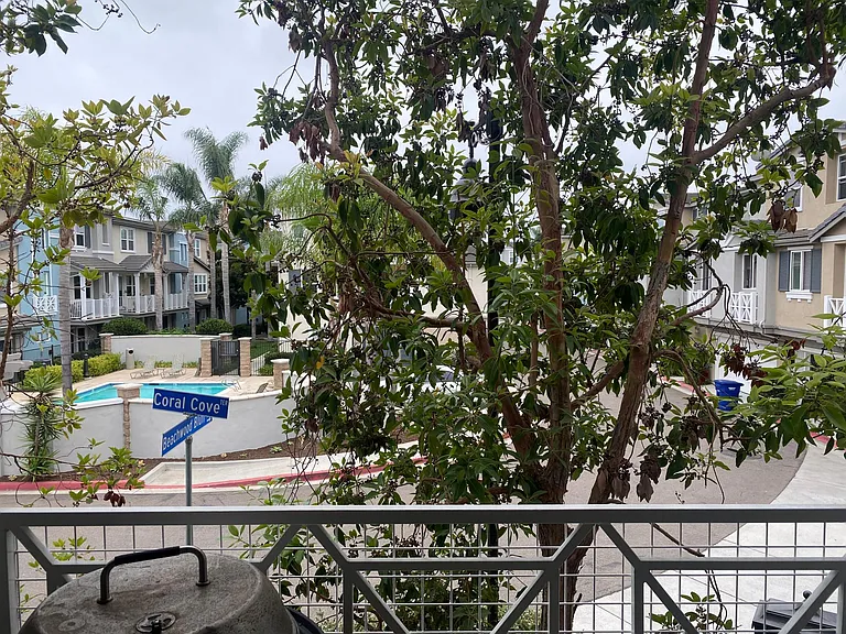 view from 2nd floor balcony with chairs and view of the pool