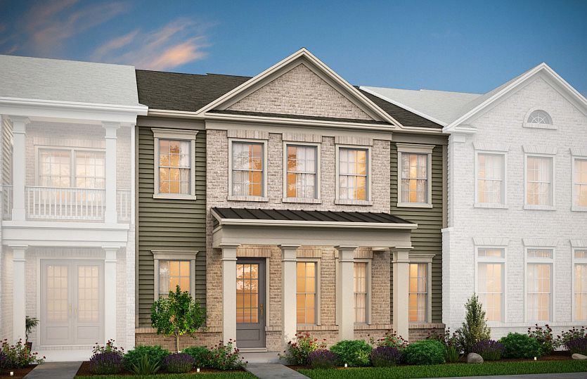 Hayden Exterior 2 features Hardi Board siding, brick accents, covered front porch and rear 2 car gar