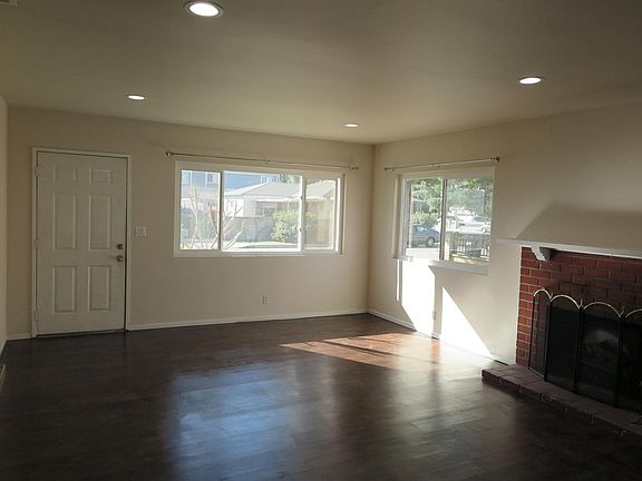 Spacious living Room with log fireplace