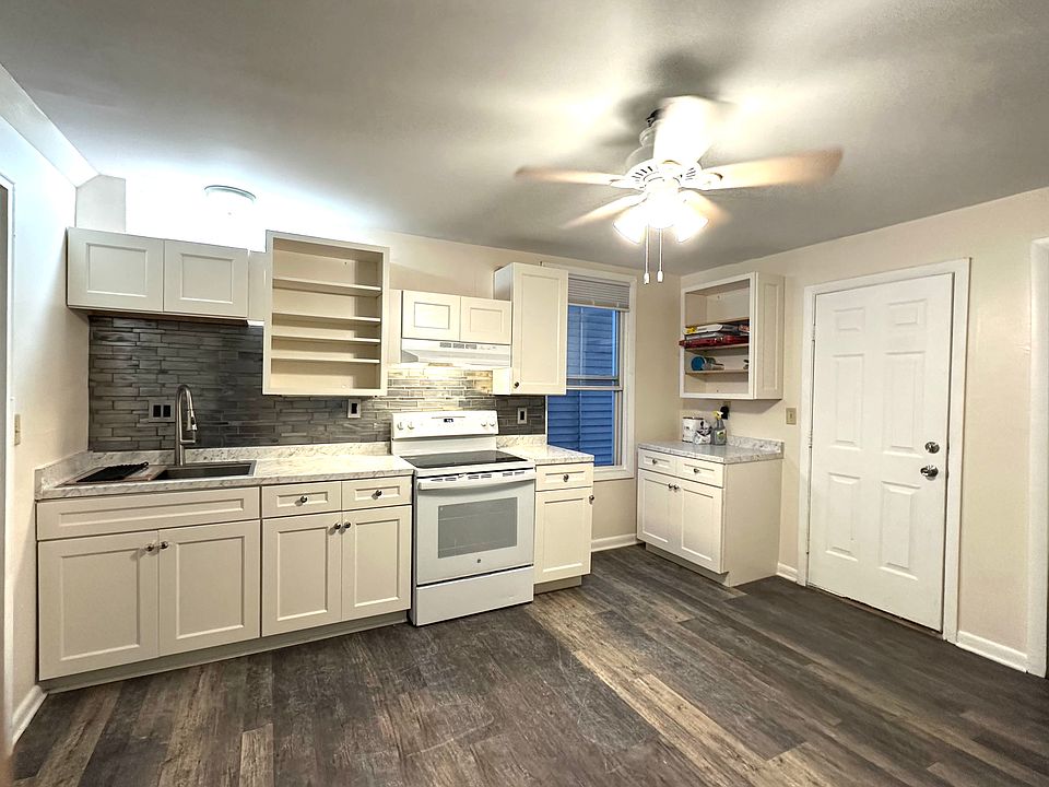 Renovated kitchen with brand ne cabinets and large workstation sink