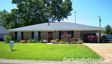 Carport Entrance Features Storage
						:
						With cabinets, hooks and cubbies, the entrance from the carport is organized.