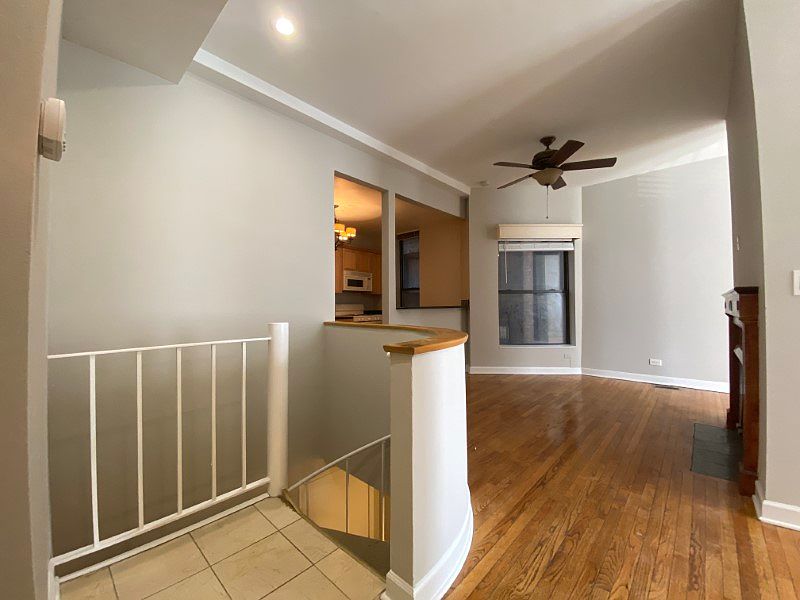 Bright living space with access to the spiral staircase