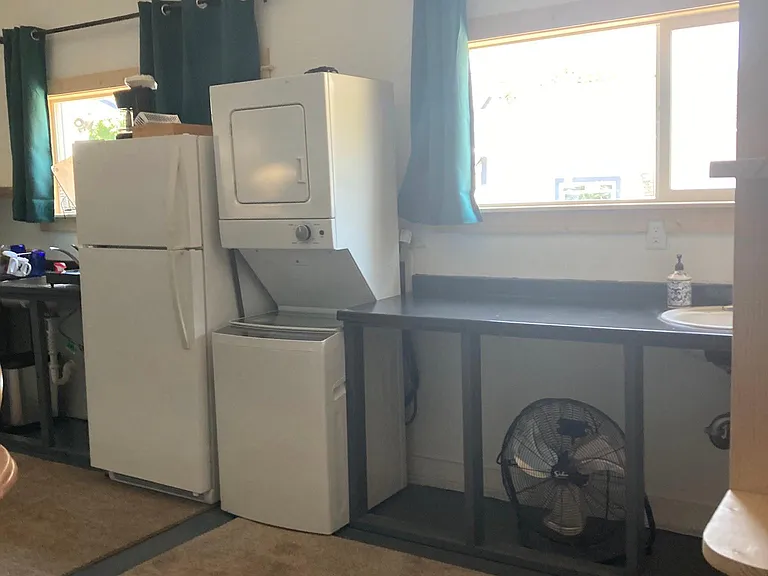 There is a good amount of counter space for folding clothes which also doubles for the counter space to the left of the bathroom sink