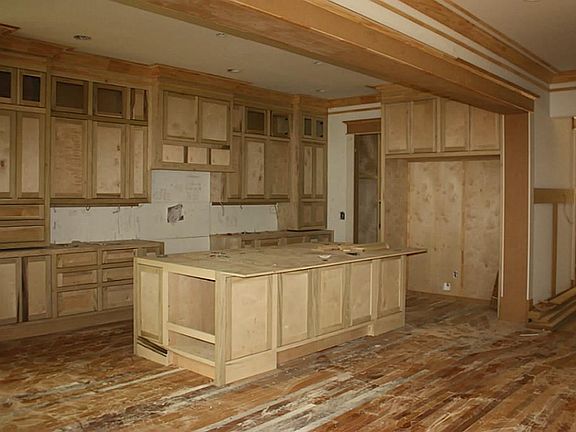 Building out the kitchen with smart cabinetry layout  including specialty areas for spices, drawers for pots, soft close hinges and glides