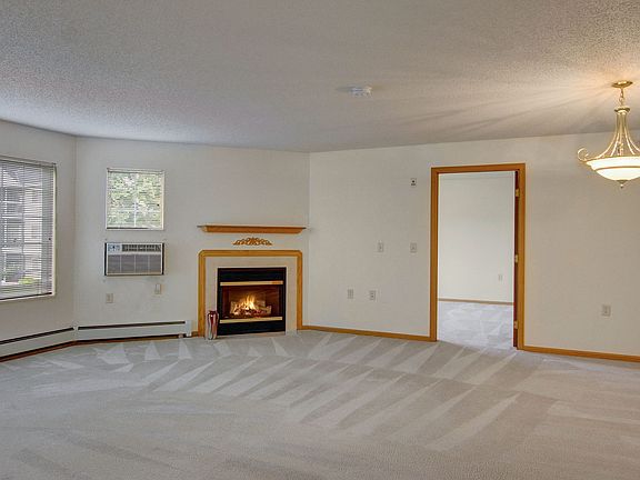 Heritage Park Living Room with Beautiful Fireplace in Select Units