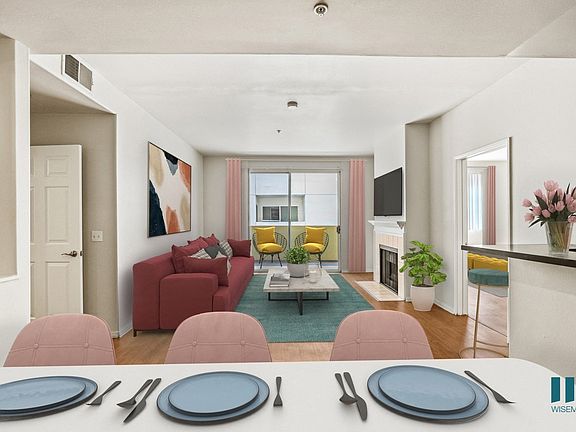 Open-Concept Kitchen, Dining, and Living Room Space with Patio