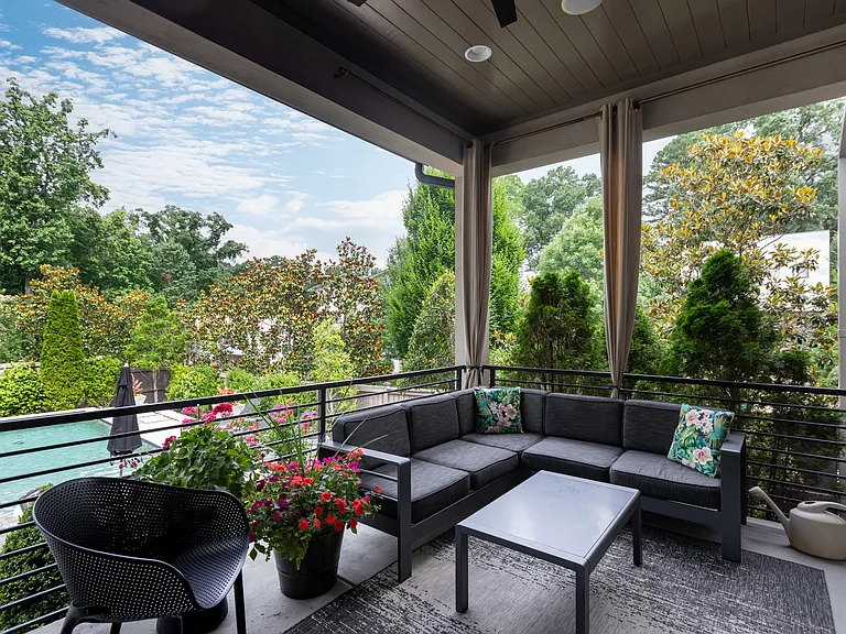 Backyard patio overlooks pool.