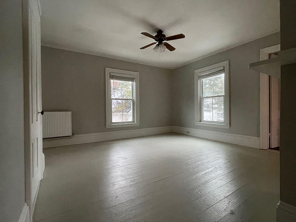View of living room from the kitchen. There is a large closet to the left in the living room.