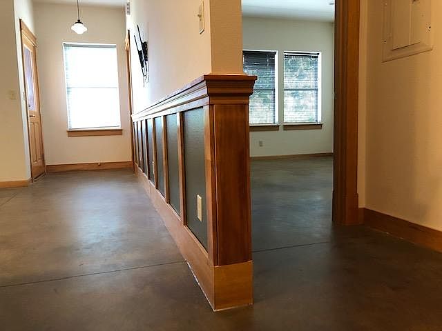Bedroom and mainroom deviding wall. Wall mount television brackets in living room and bedroom. Cable throughout. Note colored concrete floors with radiant heat, which is extremely comfortable.
