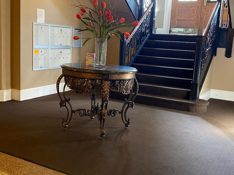 Back Entrance. Lower level with mailboxes. Optional side entrance with no steps.