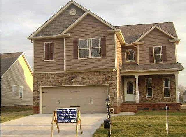 Exterior Partial Brick, Stone and Vinyl